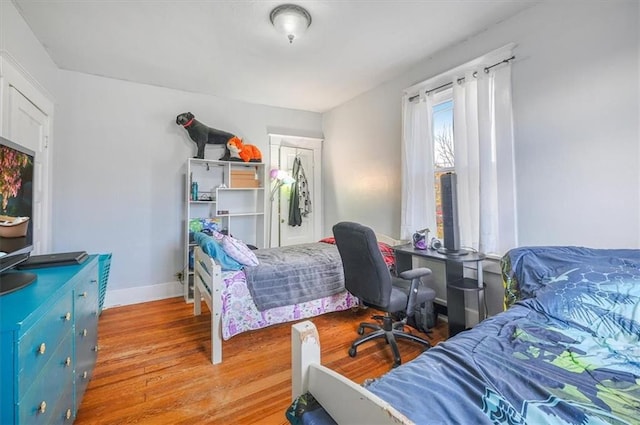 bedroom with light hardwood / wood-style flooring