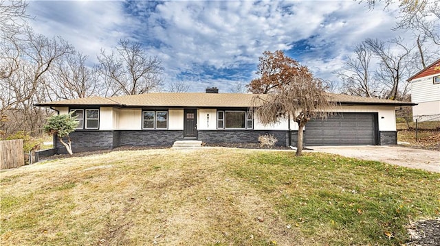 ranch-style home with a garage and a front lawn