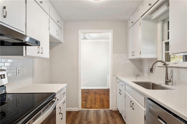 kitchen featuring stainless steel appliances, dark hardwood / wood-style floors, sink, and white cabinets