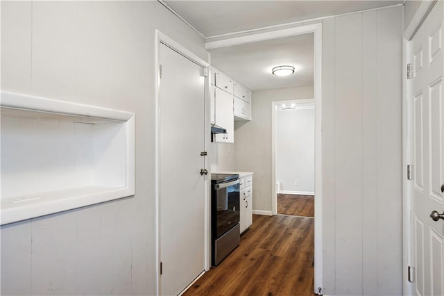 hall with dark hardwood / wood-style floors