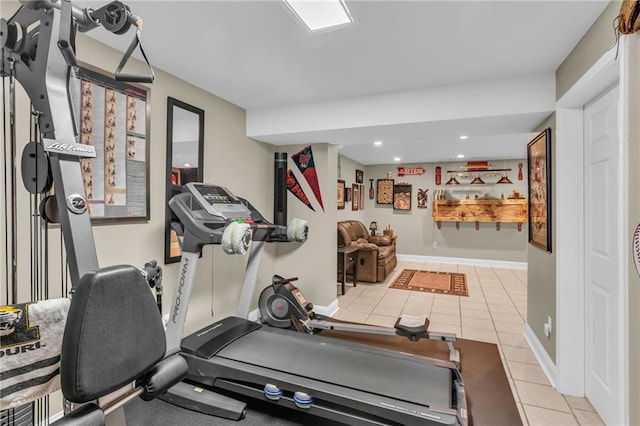 workout area featuring light tile patterned floors