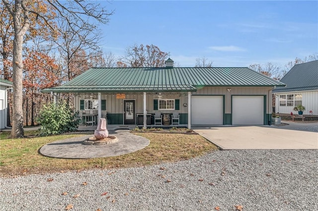 view of front of house with a garage and covered porch