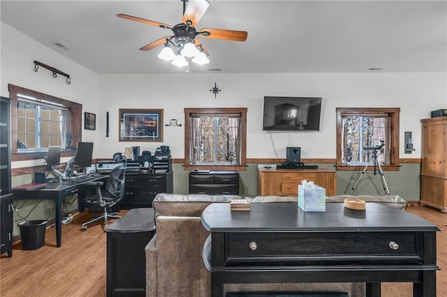 office area with ceiling fan and light wood-type flooring