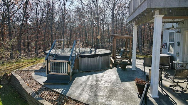 exterior space with a patio and a hot tub