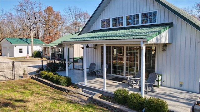 rear view of property with a lawn and a patio area