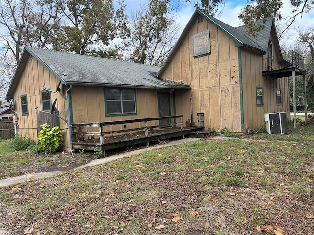 view of front of home with a deck and central AC unit