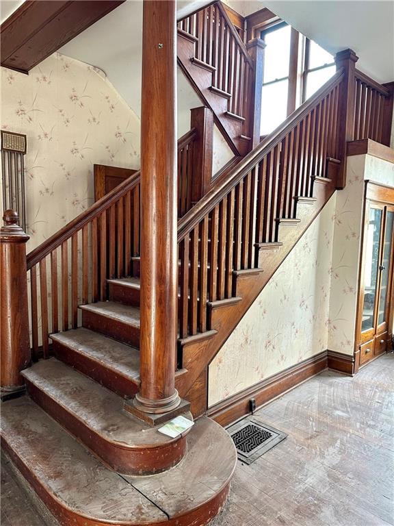 stairway with wood-type flooring