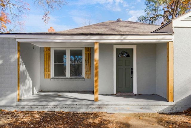 entrance to property with a porch