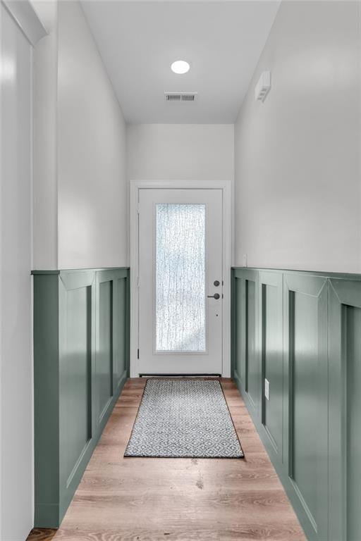 doorway to outside with light hardwood / wood-style flooring