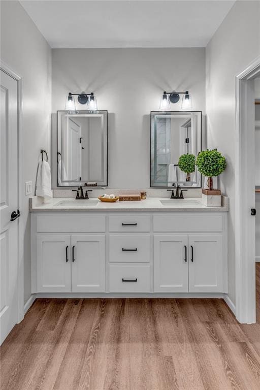 bathroom featuring vanity and hardwood / wood-style flooring