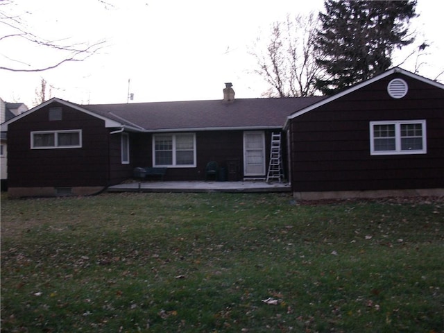 ranch-style house featuring a patio area and a front lawn