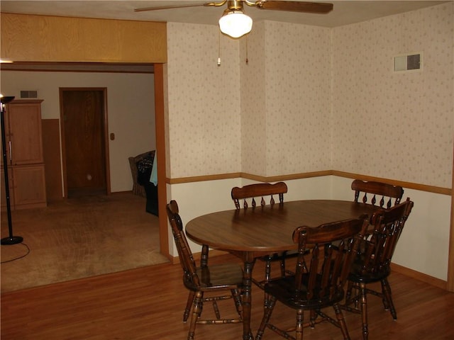 dining space featuring ceiling fan and wood-type flooring