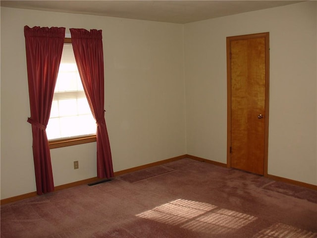 unfurnished room with carpet flooring