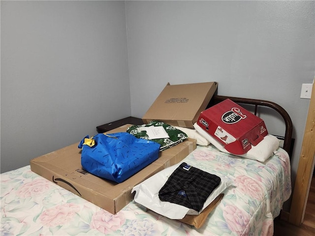 bedroom with wood-type flooring