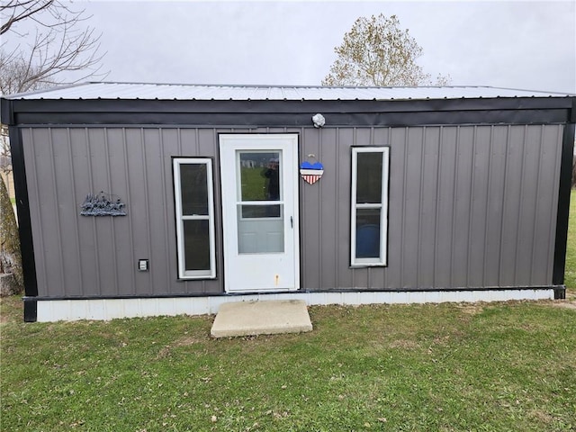 view of outbuilding featuring a yard