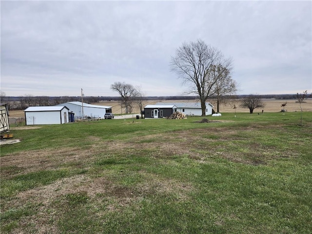 view of yard with a rural view