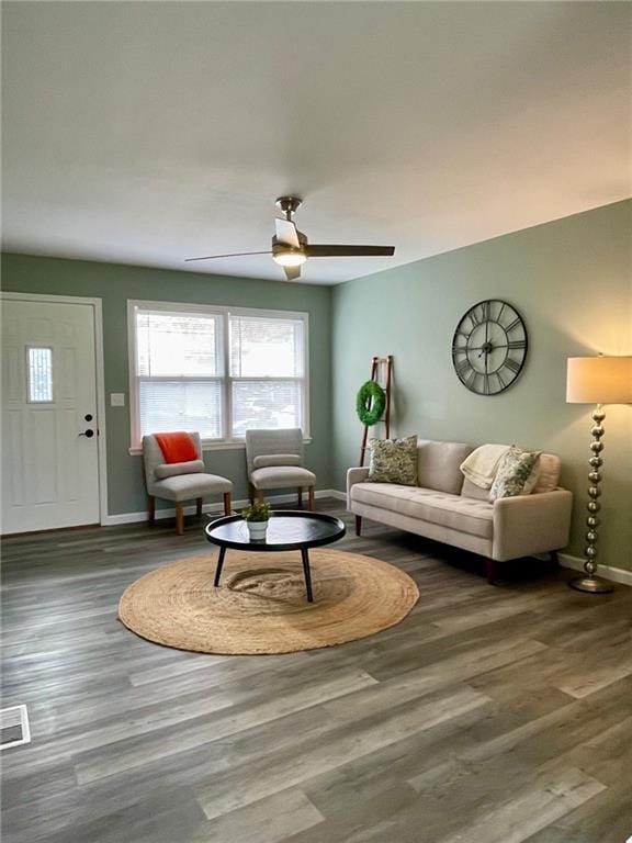 living room with ceiling fan and hardwood / wood-style floors