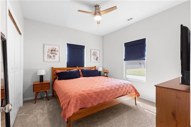 bedroom featuring carpet, ceiling fan, and a closet