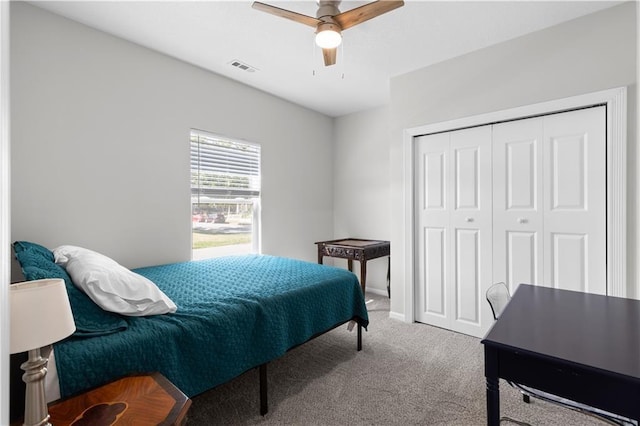 bedroom with carpet flooring, ceiling fan, and a closet