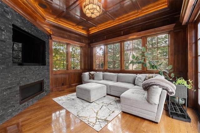 sunroom featuring a fireplace, wood ceiling, and coffered ceiling