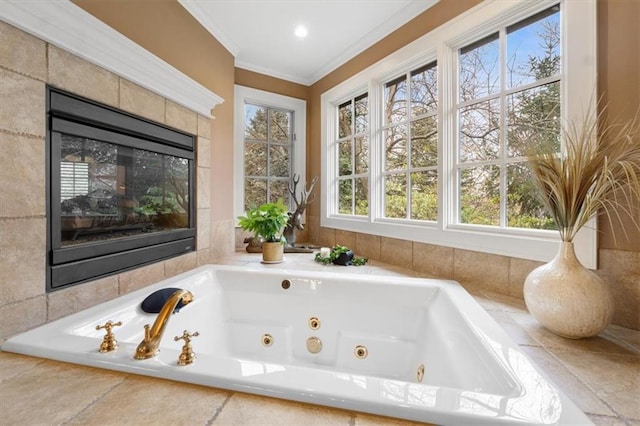 bathroom with a relaxing tiled tub and ornamental molding