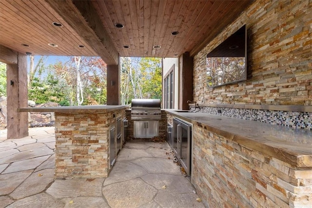 view of patio / terrace featuring sink, area for grilling, and exterior kitchen