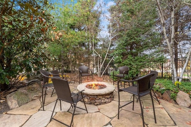 view of patio / terrace featuring an outdoor fire pit