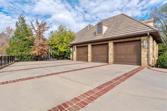 view of side of property with a garage