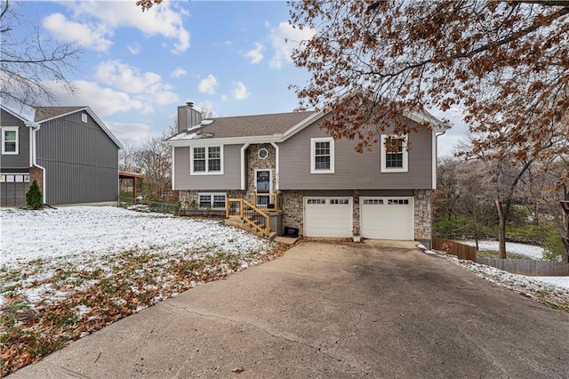 split foyer home featuring a garage