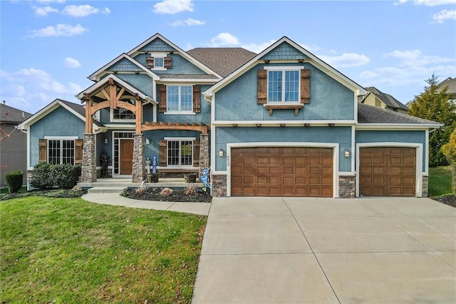 craftsman house featuring a front yard and a garage