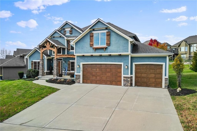 craftsman-style home with a front lawn and a garage