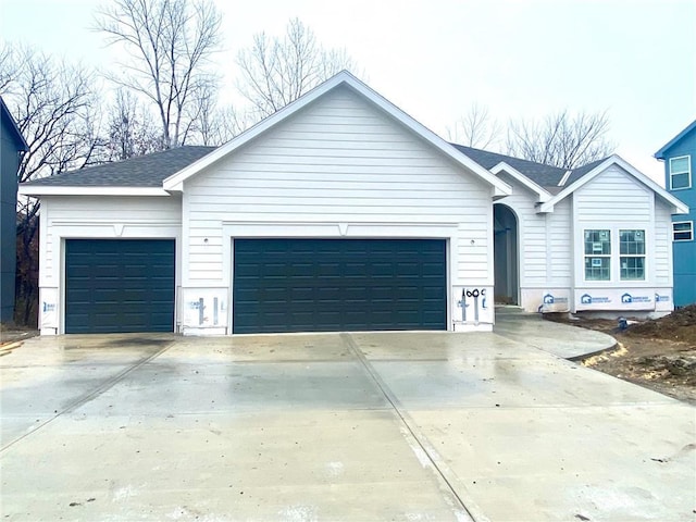 single story home featuring a garage