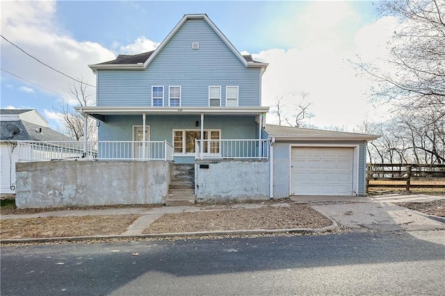 view of front of property featuring a garage and a porch