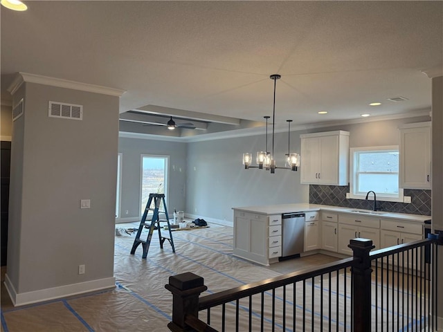 kitchen with visible vents, decorative backsplash, white cabinets, stainless steel dishwasher, and a sink