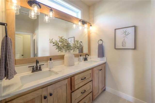 full bath with double vanity, tile patterned flooring, a sink, and visible vents