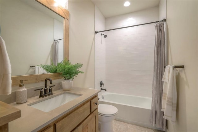 bathroom with toilet, tile patterned flooring, vanity, and shower / tub combo with curtain