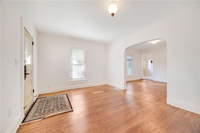 entrance foyer with light hardwood / wood-style floors and a wealth of natural light