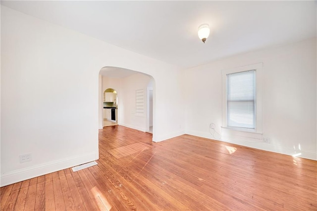 spare room featuring hardwood / wood-style floors