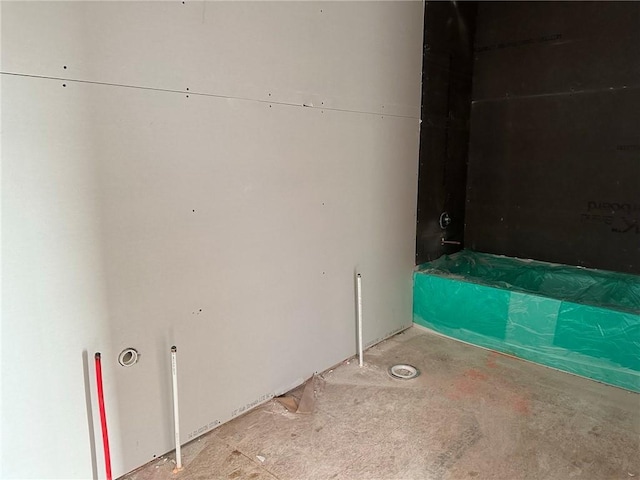 bathroom featuring concrete floors