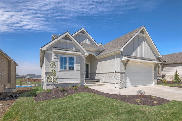 view of front of home with a garage and a front lawn