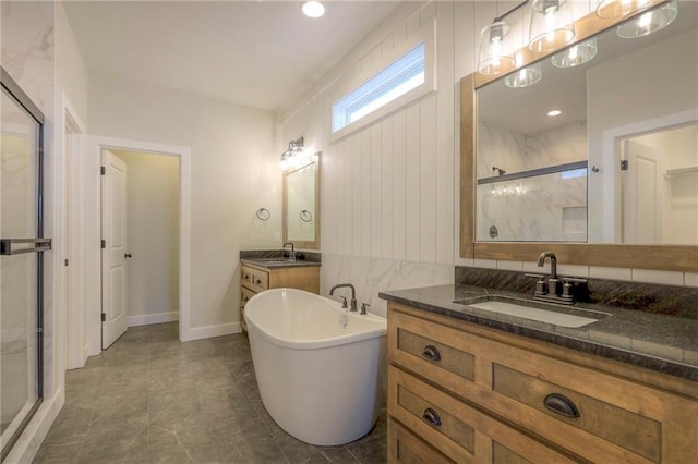 bathroom featuring vanity and separate shower and tub