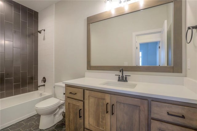 full bathroom featuring tiled shower / bath combo, vanity, and toilet