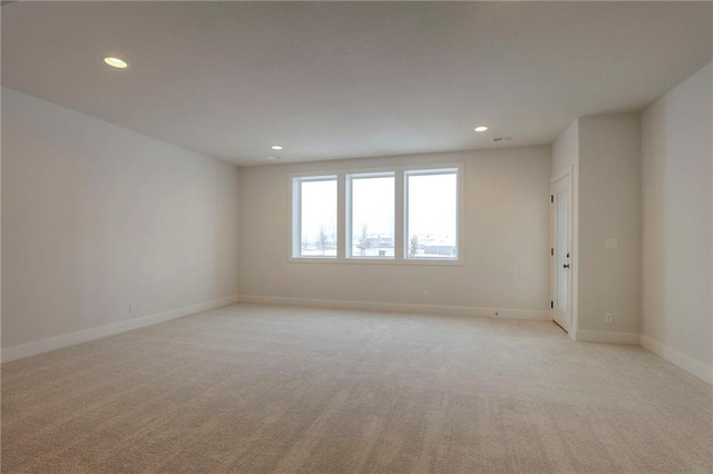 empty room featuring light colored carpet