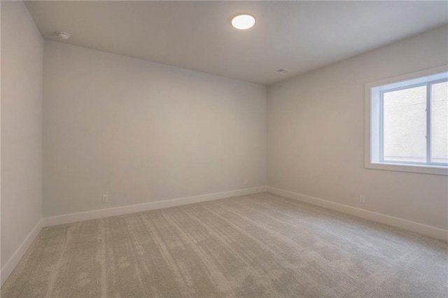 empty room featuring light carpet