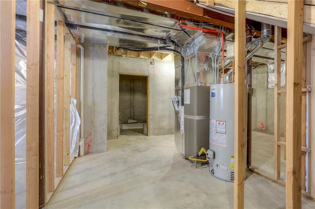 basement featuring heating unit and gas water heater