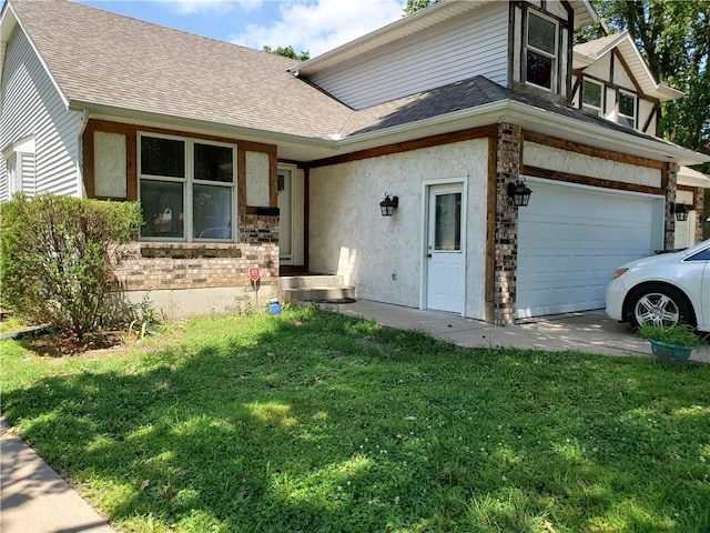 view of front of house with a front yard and a garage