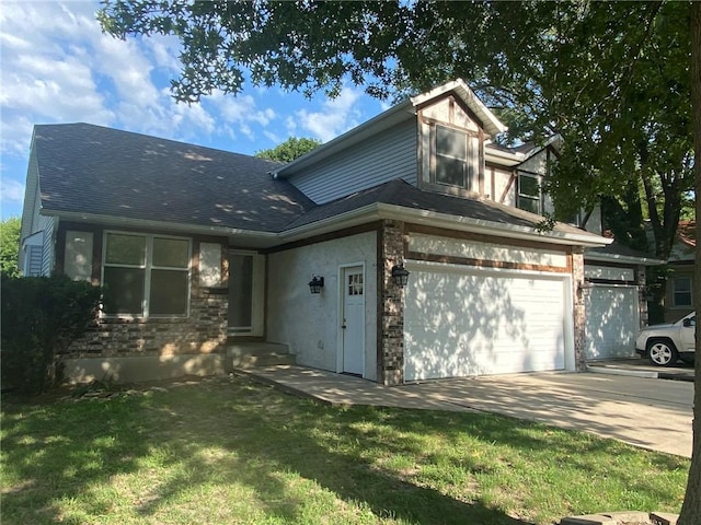 view of front of home featuring a garage and a front lawn