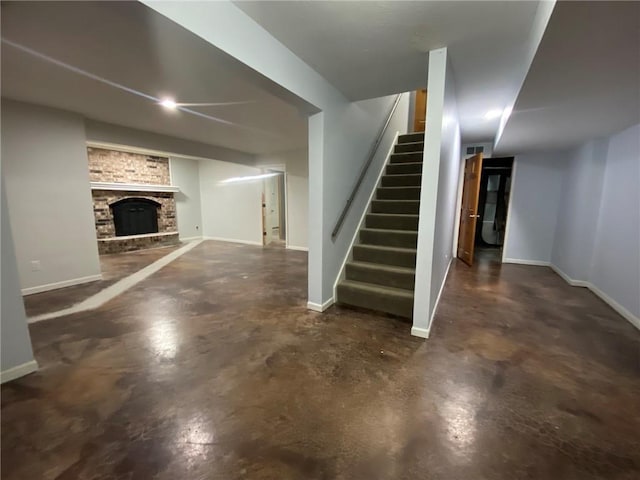 basement with a brick fireplace