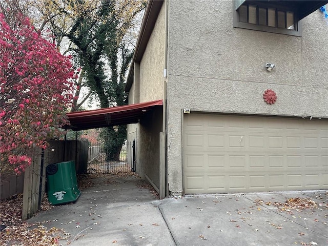 garage featuring a carport