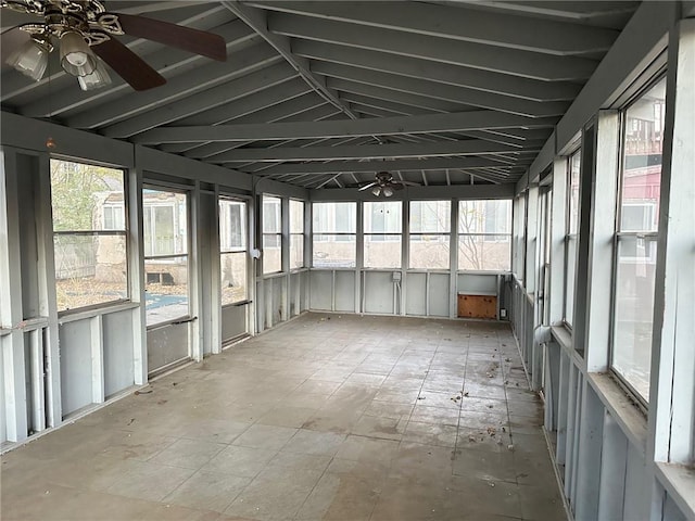 unfurnished sunroom with ceiling fan and lofted ceiling